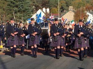 pipe band in main street carrbridge